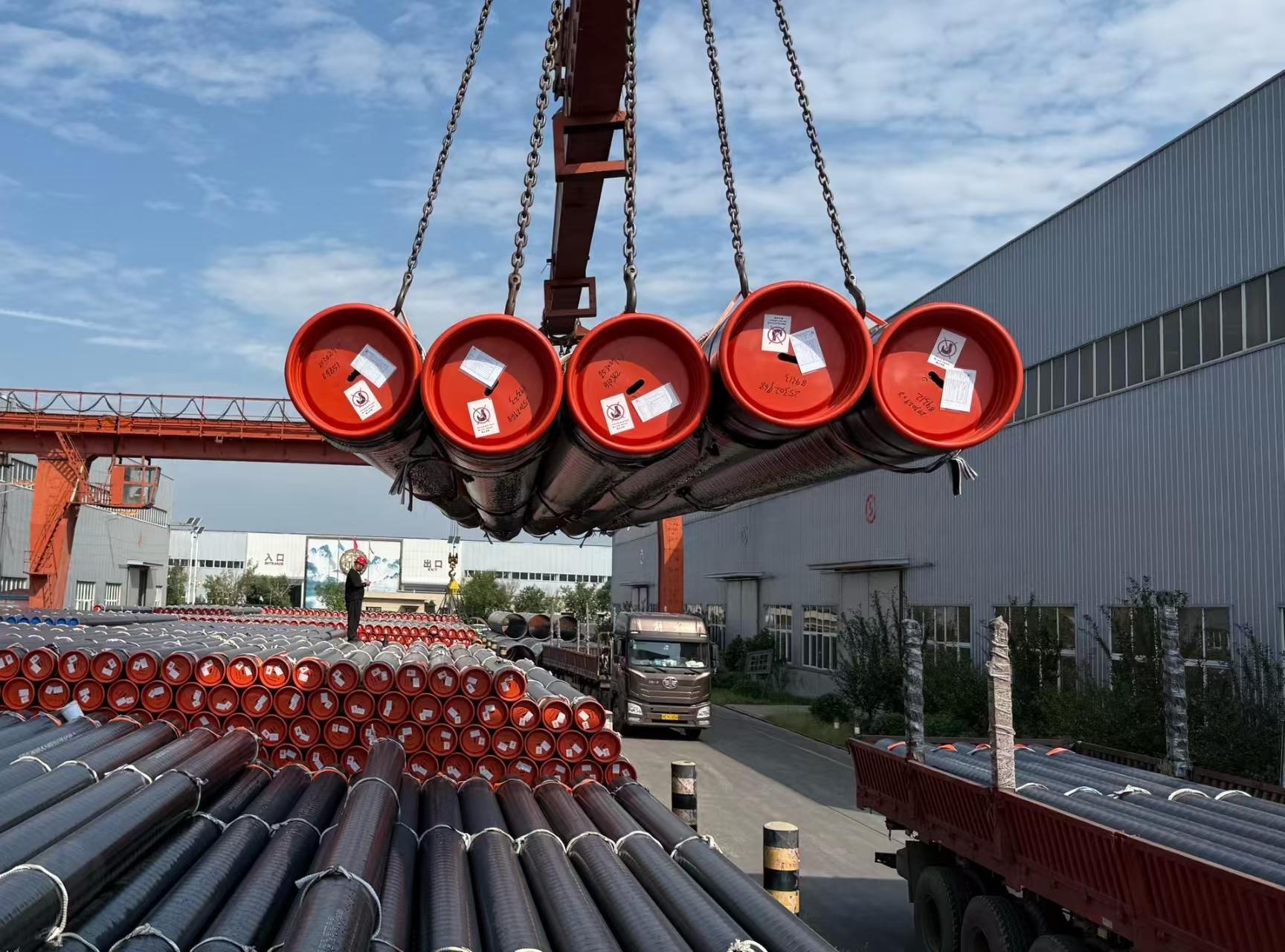 Pipe bundles lifted onto the truck for container loading